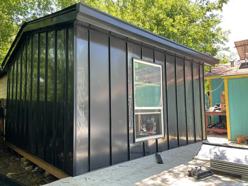 Black standing seam metal wall panels for Roof Inspection in Penn Forest