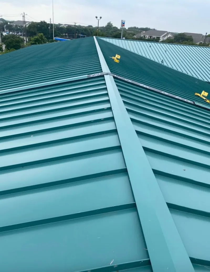 Green commercial metal roof ridge and valley for Metal Roof Repair in Penn Forest