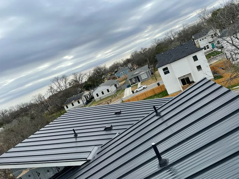 Standing seam metal roof panels with vents for Skylight Repair in Penn Forest